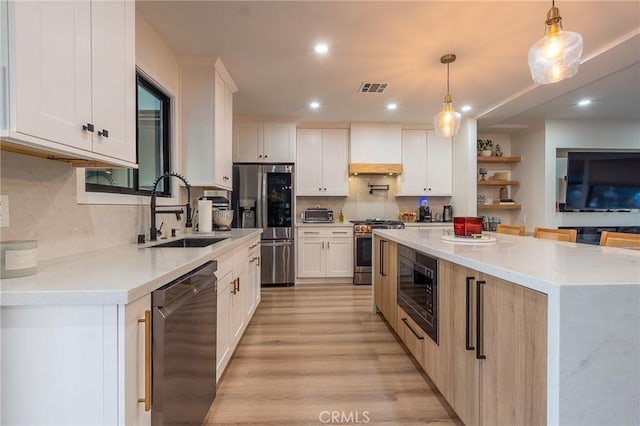 10057 Faywood, Bellflower, CA 90706 - kitchen featuring tasteful backsplash, recessed lighting, stainless steel appliances, a sink, and visible vents