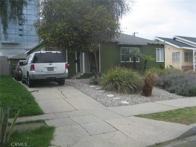 2927 S Genesee Ave, Los Angeles, CA 90016 - view of front of property with stucco siding and driveway