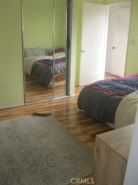 2927 S Genesee Ave, Los Angeles, CA 90016 - bedroom featuring a closet and wood finished floors