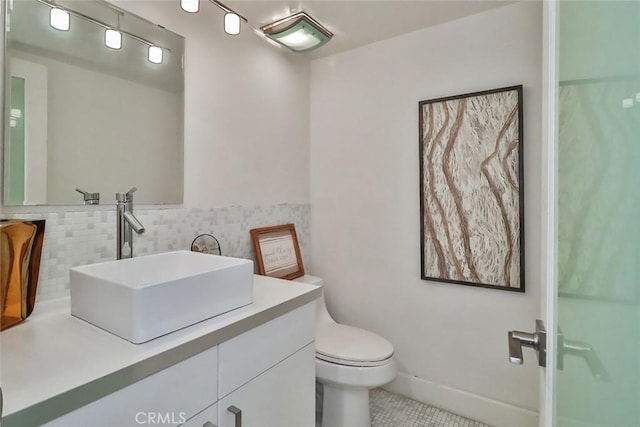 21025 Lemarsh St Unit G39, Chatsworth, CA 91311 - bathroom featuring tile patterned floors, vanity, toilet, and decorative backsplash