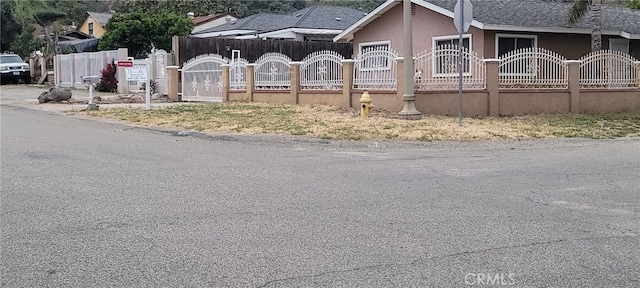 33111 Baldwin Blvd, Lake Elsinore, CA 92530 - view of property exterior featuring a fenced front yard and stucco siding