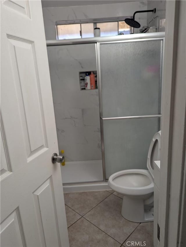 33111 Baldwin Blvd, Lake Elsinore, CA 92530 - bathroom featuring tile patterned flooring, a marble finish shower, and toilet