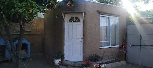 33111 Baldwin Blvd, Lake Elsinore, CA 92530 - doorway to property with stucco siding and fence