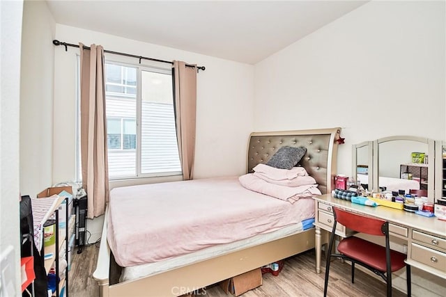 bedroom featuring wood finished floors