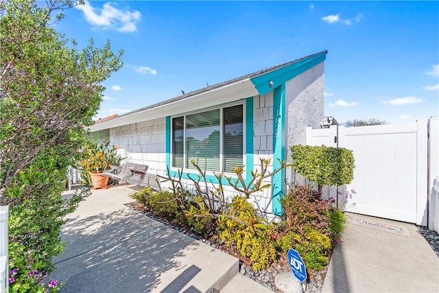 view of property exterior featuring fence