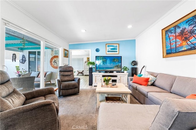 living area with wood finished floors, crown molding, and recessed lighting