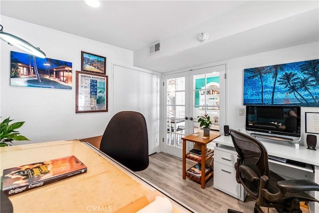 home office with visible vents, light wood-type flooring, french doors, and recessed lighting