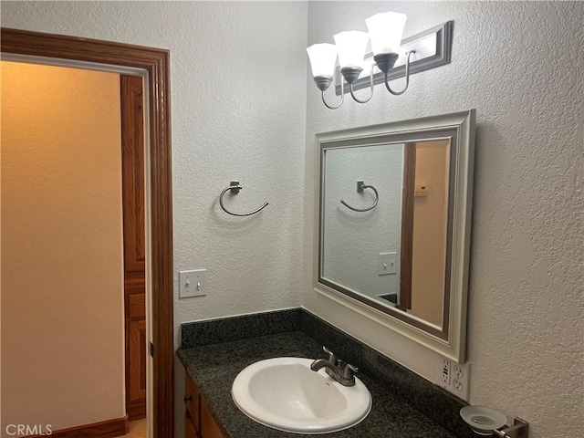 8740 S Loop Blvd, California City, CA 93505 - bathroom featuring vanity and a chandelier