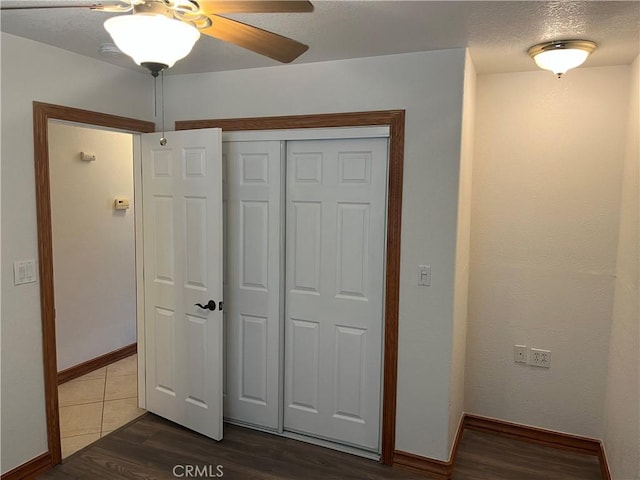 8740 S Loop Blvd, California City, CA 93505 - unfurnished bedroom featuring baseboards, a closet, and dark wood-style floors