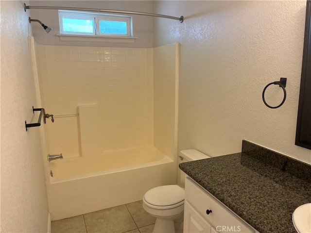 8740 S Loop Blvd, California City, CA 93505 - full bath featuring vanity, toilet, a textured wall, and tile patterned flooring