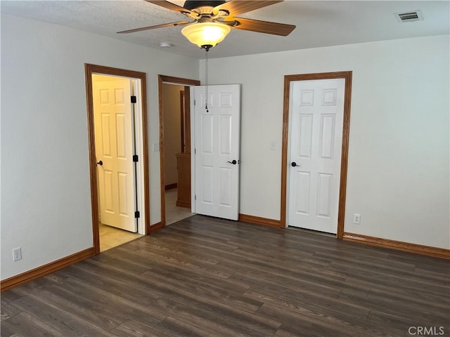 8740 S Loop Blvd, California City, CA 93505 - unfurnished bedroom featuring wood finished floors, visible vents, and baseboards
