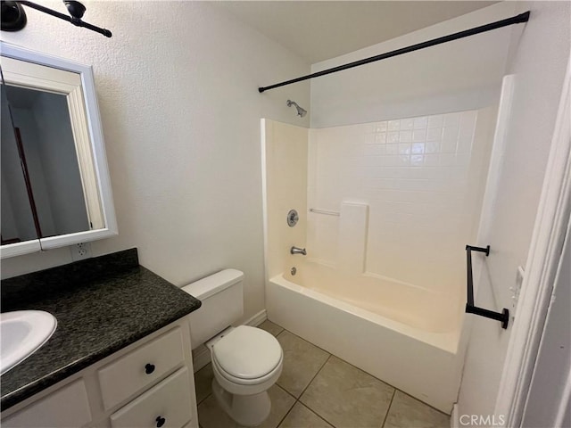 8740 S Loop Blvd, California City, CA 93505 - bathroom featuring toilet, tile patterned floors, vanity, and bathing tub / shower combination