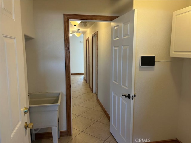 8740 S Loop Blvd, California City, CA 93505 - hallway with light tile patterned floors and baseboards