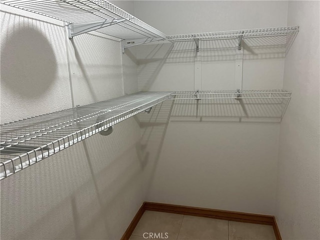 8740 S Loop Blvd, California City, CA 93505 - spacious closet featuring tile patterned floors