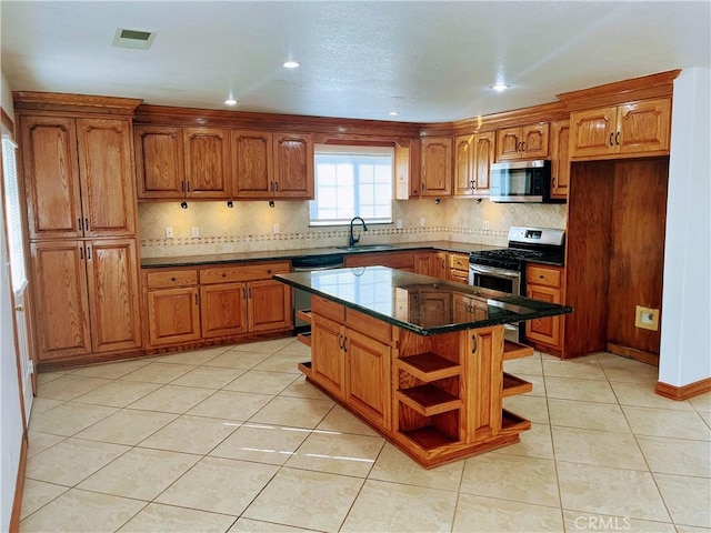 8740 S Loop Blvd, California City, CA 93505 - kitchen with a sink, brown cabinetry, stainless steel appliances, and open shelves