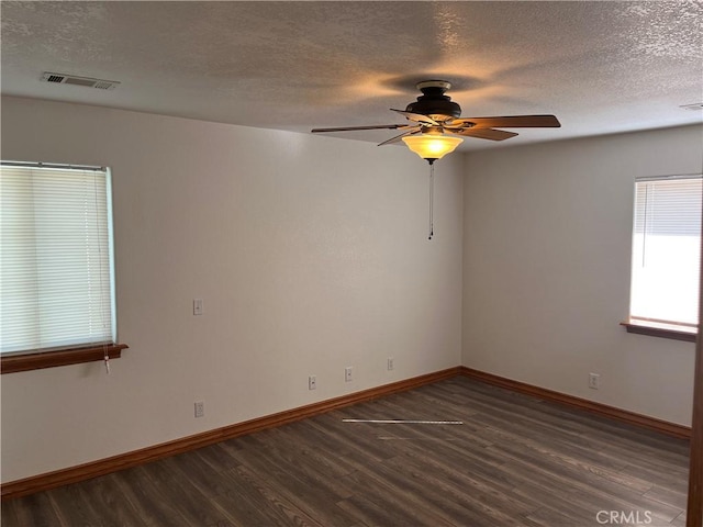 8740 S Loop Blvd, California City, CA 93505 - spare room with a ceiling fan, a textured ceiling, baseboards, visible vents, and wood finished floors