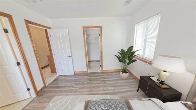 8740 S Loop Blvd, California City, CA 93505 - interior space with a closet, wood finished floors, baseboards, and a spacious closet