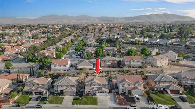 bird's eye view featuring a mountain view and a residential view