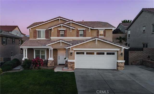 craftsman-style home with driveway, covered porch, a lawn, and stucco siding
