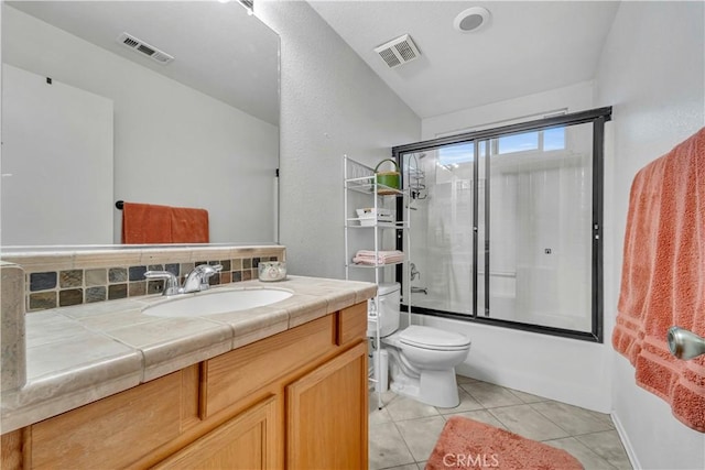 bathroom with visible vents, toilet, tile patterned flooring, and vanity