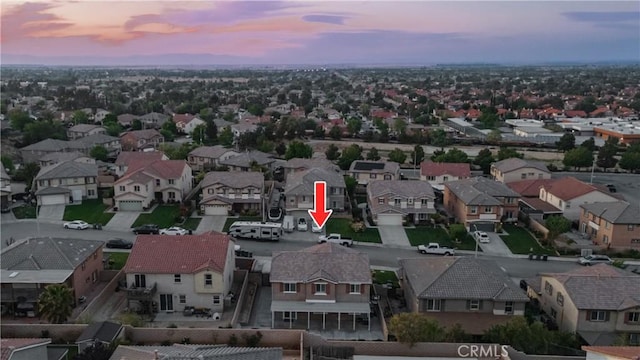 aerial view at dusk with a residential view
