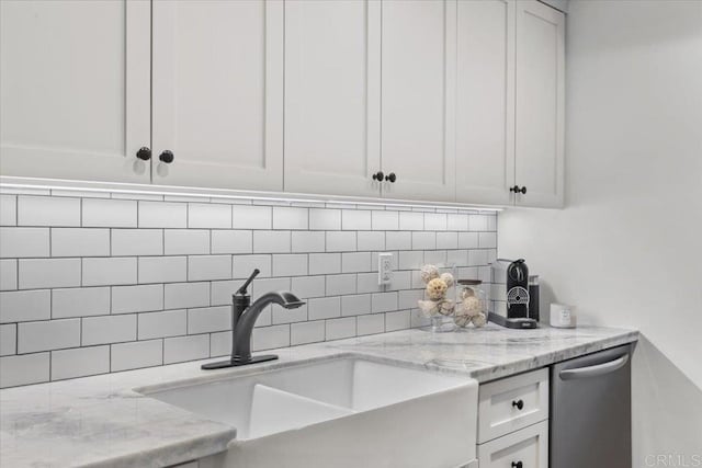 2715 Camino Del Mar, Del Mar, CA 92014 - kitchen with a sink, backsplash, white cabinetry, light stone countertops, and stainless steel dishwasher