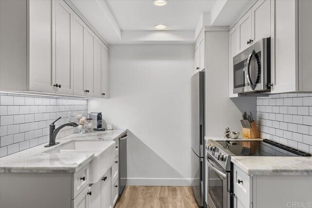 2715 Camino Del Mar, Del Mar, CA 92014 - kitchen featuring stainless steel appliances, backsplash, a sink, baseboards, and recessed lighting