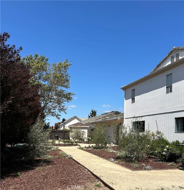view of home's exterior featuring fence