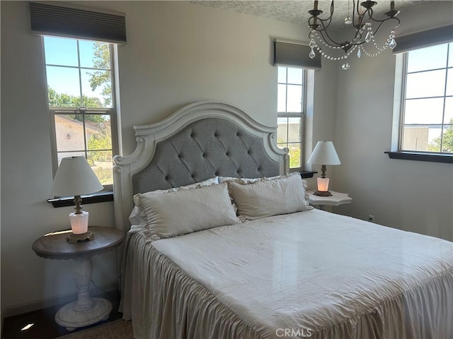 1160 Easy Ln, Nipomo, CA 93444 - bedroom with a chandelier and multiple windows