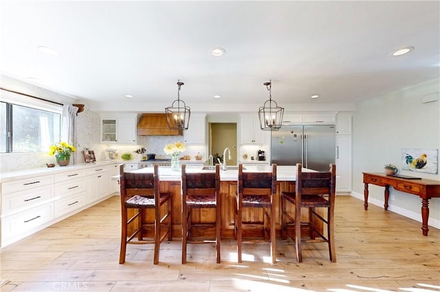 1160 Easy Ln, Nipomo, CA 93444 - dining space featuring light wood finished floors, a chandelier, recessed lighting, and baseboards