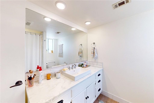 1160 Easy Ln, Nipomo, CA 93444 - bathroom featuring vanity, toilet, wood finished floors, baseboards, and recessed lighting