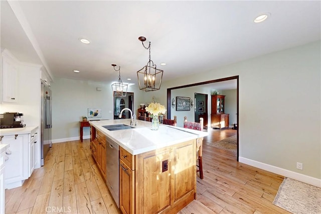1160 Easy Ln, Nipomo, CA 93444 - kitchen with a sink, appliances with stainless steel finishes, light countertops, light wood-style floors, and recessed lighting