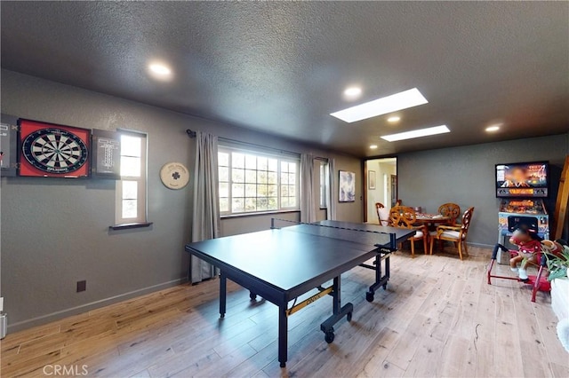 1160 Easy Ln, Nipomo, CA 93444 - playroom with a skylight, wood finished floors, a textured ceiling, recessed lighting, and baseboards