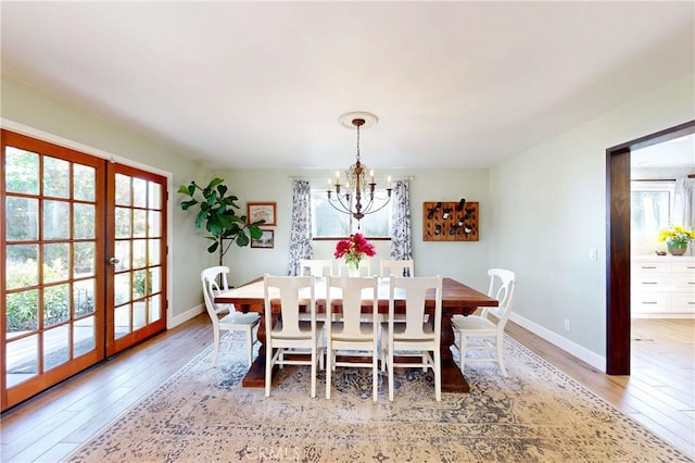 1160 Easy Ln, Nipomo, CA 93444 - dining area featuring light wood-style floors, a chandelier, baseboards, and french doors