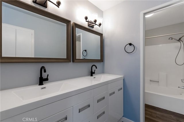 3913 N Virginia Rd Unit 207, Long Beach, CA 90807 - bathroom with double vanity, shower / bathing tub combination, wood finished floors, and a sink