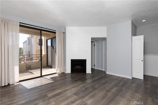 3913 N Virginia Rd Unit 207, Long Beach, CA 90807 - unfurnished living room featuring a fireplace and wood finished floors