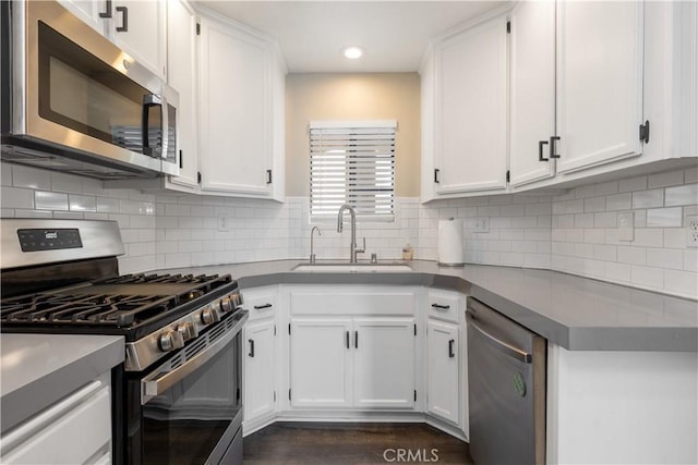 3913 N Virginia Rd Unit 207, Long Beach, CA 90807 - kitchen featuring tasteful backsplash, recessed lighting, stainless steel appliances, white cabinets, and a sink