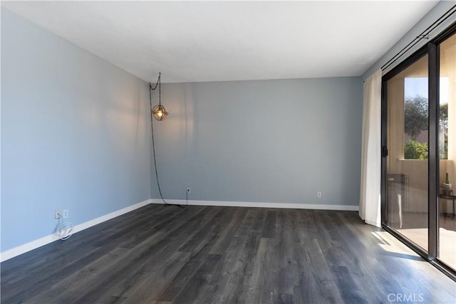 3913 N Virginia Rd Unit 207, Long Beach, CA 90807 - unfurnished room with visible vents, dark wood finished floors, and baseboards