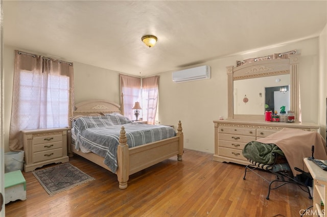 650 N Acacia, Rialto, CA 92376 - bedroom with a wall mounted AC and wood finished floors