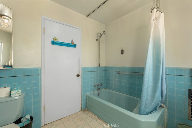 650 N Acacia, Rialto, CA 92376 - bathroom featuring tile walls, wainscoting, tile patterned floors, and shower / bath combination with curtain
