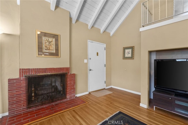 650 N Acacia, Rialto, CA 92376 - living area featuring wood finished floors, a fireplace, a wooden ceiling with exposed beams, and high vaulted ceiling