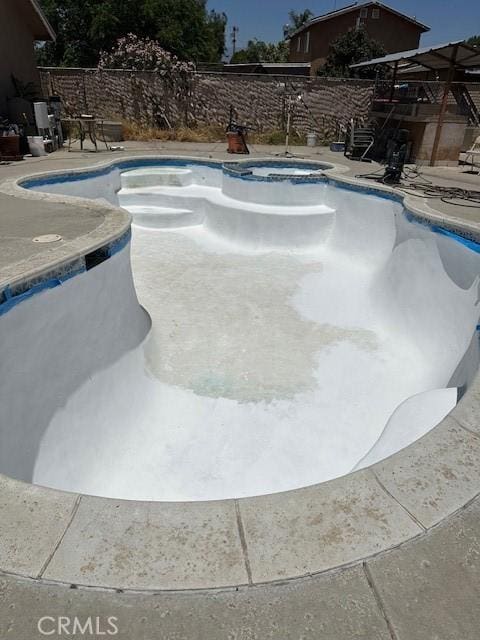 650 N Acacia, Rialto, CA 92376 - view of swimming pool featuring a fenced backyard, a pool with connected hot tub, and a patio area