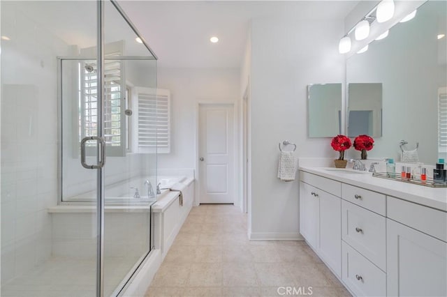 full bathroom with vanity, a shower stall, tile patterned floors, and a garden tub