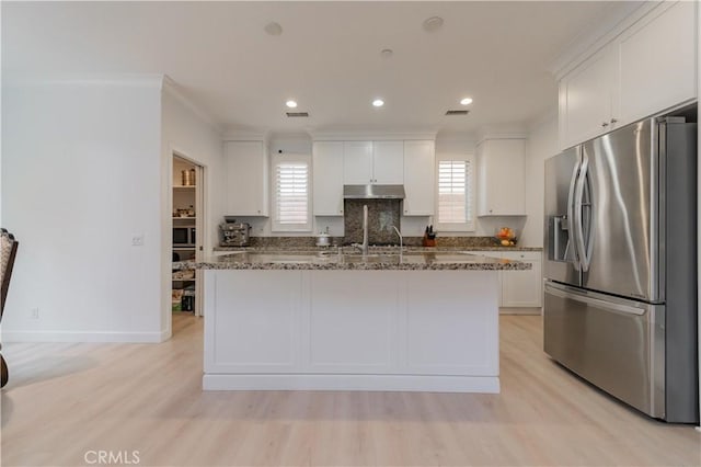 kitchen featuring appliances with stainless steel finishes, ornamental molding, under cabinet range hood, and white cabinetry