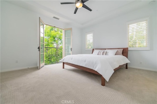 bedroom with baseboards, access to outside, carpet floors, and visible vents