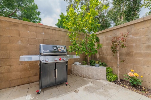 view of patio / terrace with fence and area for grilling