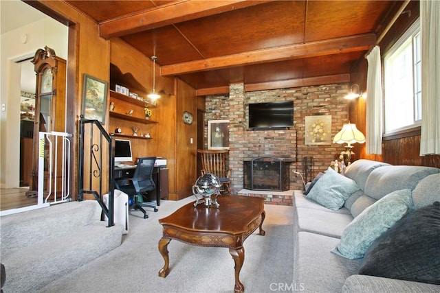 8913 Bexley Dr, Pico Rivera, CA 90660 - carpeted living room featuring wooden walls, wood ceiling, a brick fireplace, and beam ceiling