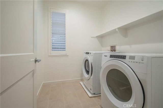 556 W Baseline Rd, Claremont, CA 91711 - laundry room featuring baseboards, light tile patterned flooring, separate washer and dryer, and laundry area