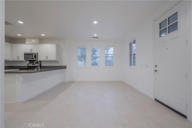 556 W Baseline Rd, Claremont, CA 91711 - kitchen with white cabinets, recessed lighting, appliances with stainless steel finishes, and baseboards