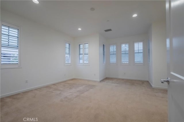556 W Baseline Rd, Claremont, CA 91711 - spare room featuring visible vents, baseboards, light carpet, and a healthy amount of sunlight